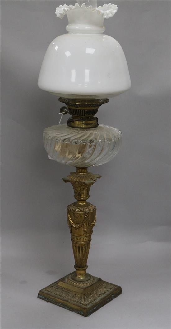 A glass and brass oil lamp